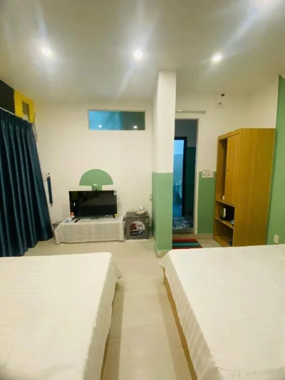 Habitación cuádruple con baño privado — La Tortue Saigon - Boutique Homestay Near Turtle Lake